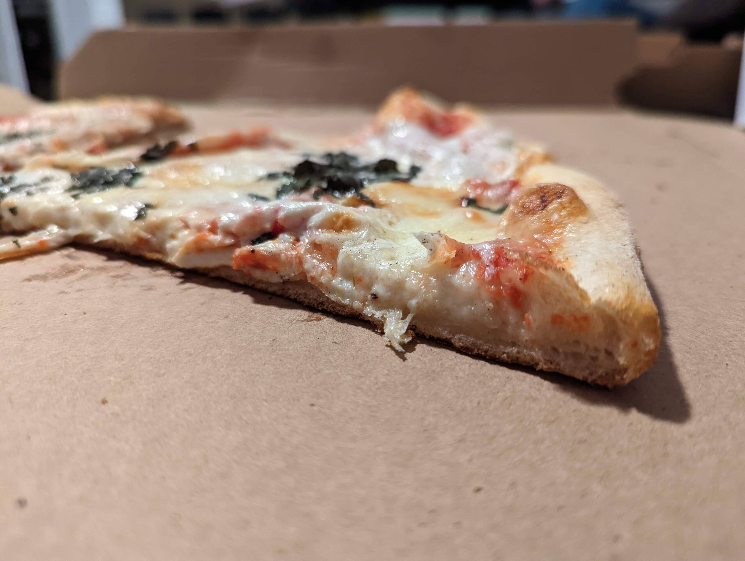 11-dominicks-small-margherita-pizza-slice-side